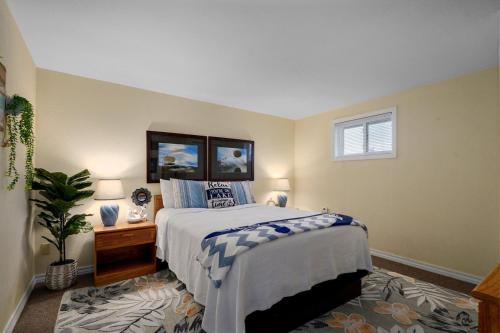 a bedroom with a large bed and a window at Poolside Retreat at Kimberling Crossing in Kimberling City
