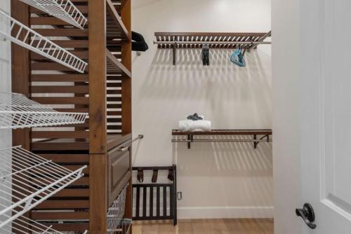 a winding staircase in a room with wooden rails at Coastal Dream Heated Pool Near Beach and Disney in Long Beach