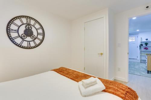 a bedroom with a large clock on the wall at Walk to Kauneonga Lake Home with Deck and Grill in White Lake