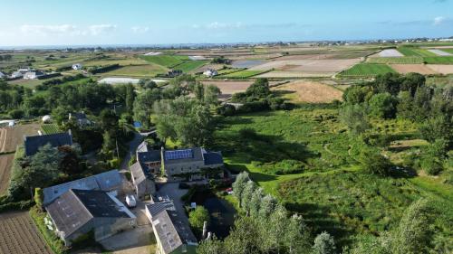 an aerial view of a house in a field at Cottage Batz - Moulin de Kerellec in Plougoulm