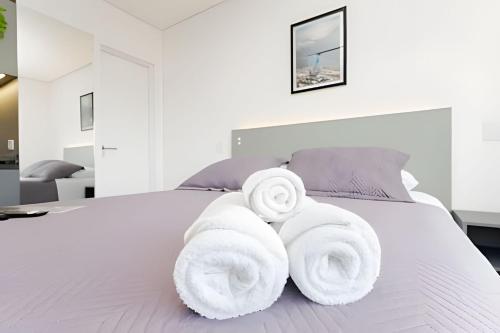 Postel nebo postele na pokoji v ubytování Apartamentos modernos próximo ao Jardim Botanico e à Rodoviária