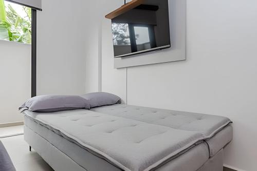 Cama o camas de una habitación en Apartamento garden super moderno próximo ao Jardim Botanico e à Rodoviária - Cama Queen/WIFI/Ar Condicionado
