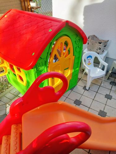a play set with a play house and a table at Vikendica Drinski mir in Loznica