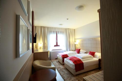 Posteľ alebo postele v izbe v ubytovaní Hotel Raca