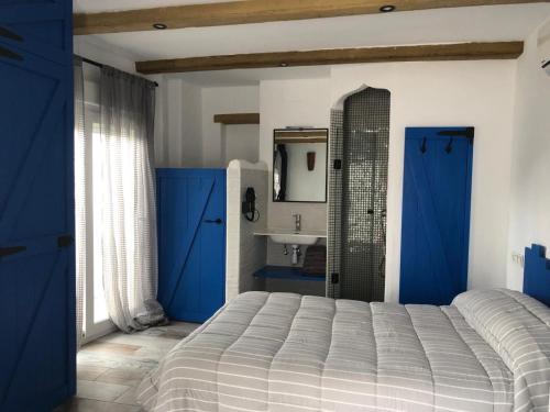 Postel nebo postele na pokoji v ubytování Las Casitas de mi Abuela