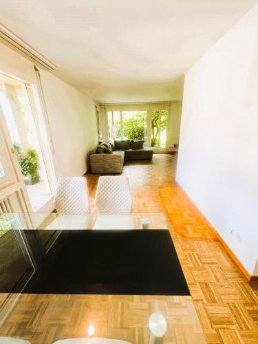 a living room with a couch and a table at Large Flats, Zurich Lake HWA - Self Checkin in Zürich