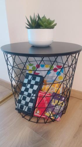 a black round table with a bowl on top at Apartma Zora in Bovec