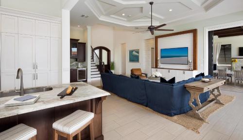 a kitchen with a large blue tub in a room at Hollyhock in Marco Island