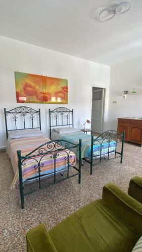 Postel nebo postele na pokoji v ubytování Apartment Caorso Rino