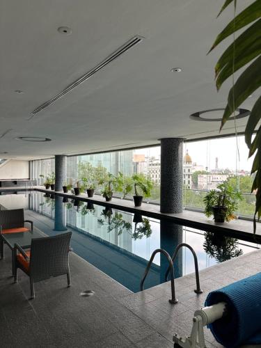 a large building with a pool with plants on it at Residencias Plaza in Mexico City