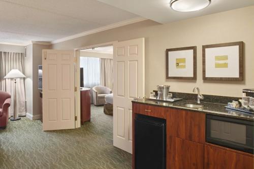 a hotel room with a sink and a bathroom at DoubleTree by Hilton Akron Fairlawn in Fairlawn