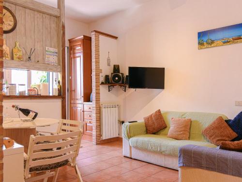 a living room with a couch and a table at Rustico al mare in Ladispoli