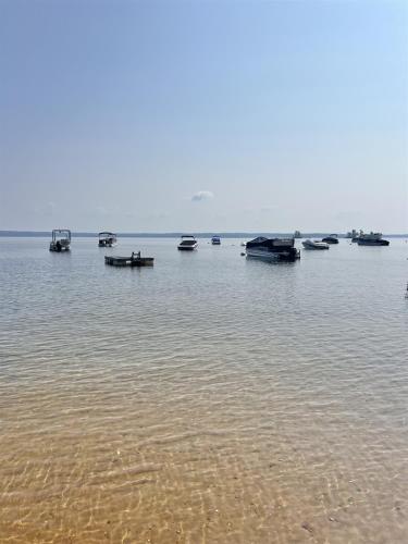 a group of boats sitting in the water at HARMON'S BEACH LIMIT 5 villa in Standish