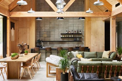 a living room with couches and a table at AutoCamp Catskills in Saugerties