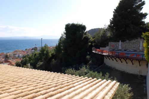 an overhead view of a roof with the ocean in the background at Agrabeli Apartments in Limne
