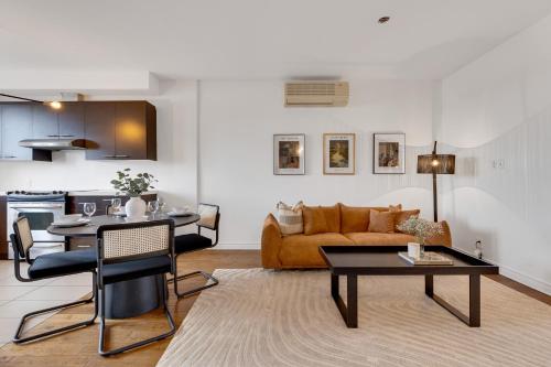 a living room with a couch and a table at Lofts de la petite Italie in Montréal
