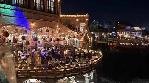 a group of people sitting at a restaurant at night at Luxury, Ocean View, Pool, Jacuzzi, Valle de Guadalupe, Los Portales De Garcia, Splash, Encanto Restaurants, Surf Breaks in Primo Tapia, Rosarito in Rosarito