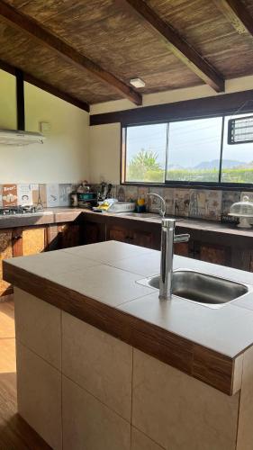a kitchen with a sink and a counter at Accommodation in Huaral in Huaral
