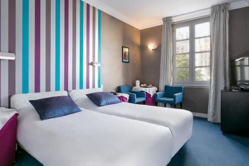 Un ou plusieurs lits dans un hébergement de l'établissement Best Western Hotel Le Guilhem