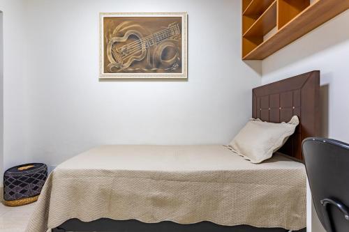 Ένα ή περισσότερα κρεβάτια σε δωμάτιο στο Quarto de Solteiro em Residência Compartilhada