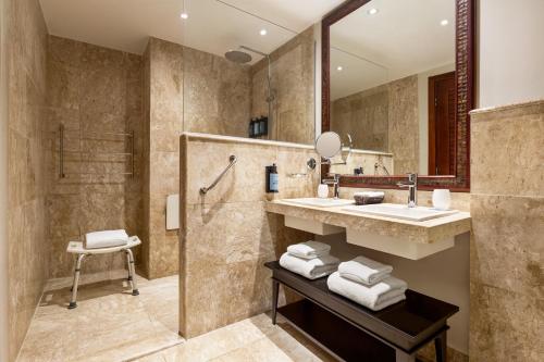 a bathroom with a sink and a shower at Grand Palladium Imbassaí Resort & Spa - All Inclusive in Imbassai