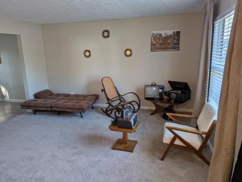 a living room with a couch and a chair at Charming 3 Bedroom Home in Conley