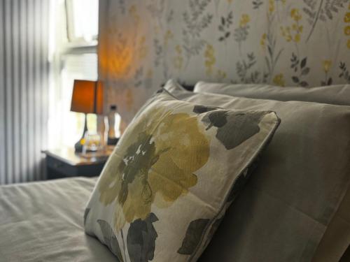 a bed with a pillow on it in a bedroom at KAYUMBA Properties LTD in Leeds
