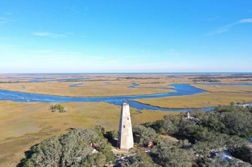 an aerial view of a lighthouse next to a river at Marsh Haven in Southport