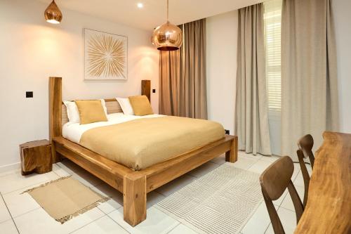 Katil atau katil-katil dalam bilik di Alma Apart Residence