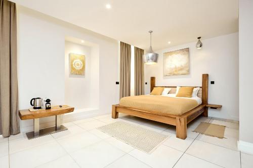 Katil atau katil-katil dalam bilik di Alma Apart Residence