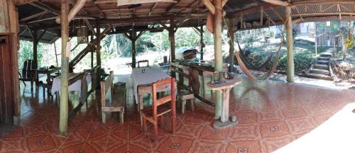 a room with a table and chairs in a building at Rincon Ecologico Cultural Terraba in Buenos Aires