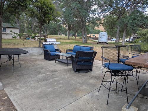 a group of chairs and tables in a park at Squaw Valley Motel Room 2 in Squaw Valley