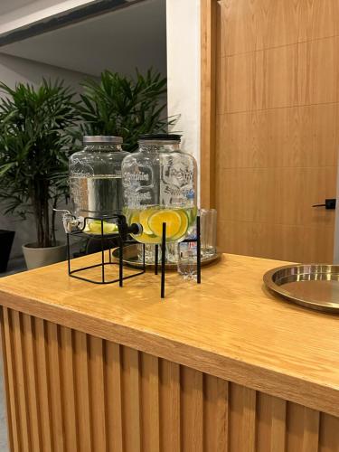 a group of glass jars sitting on top of a counter at Casa Begonias Hotel mas Villas in Jiutepec