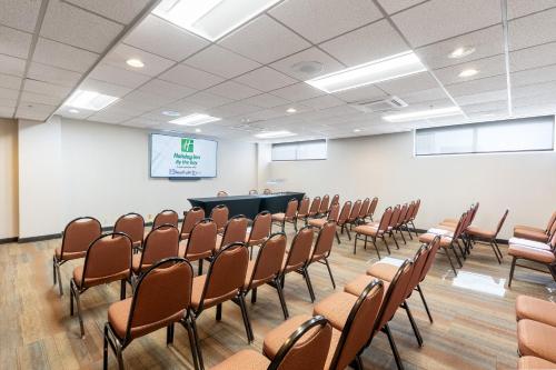 a lecture room with chairs and a podium at Holiday Inn Portland-By the Bay by IHG in Portland