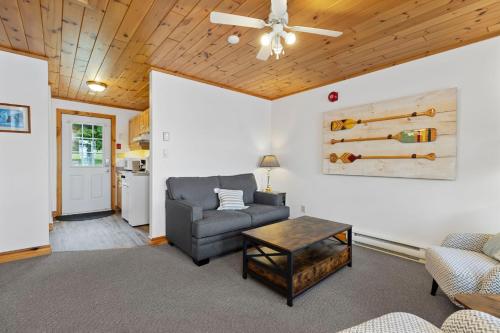 a living room with a couch and a table at Port Cunnington Lodge in Dwight