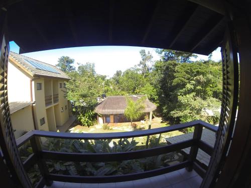 a view of a house from a balcony at Pousada Samburá in Barra do Una