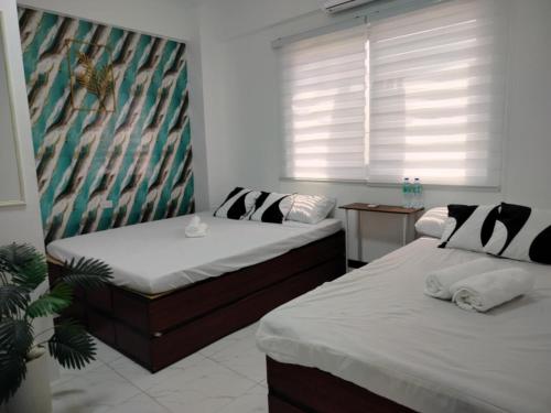 Voodi või voodid majutusasutuse Marias Transient Family Room toas
