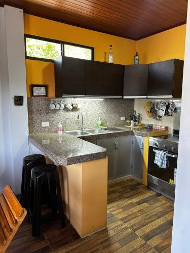 a kitchen with a sink and a counter top at A Lovely Retreat in Salinas