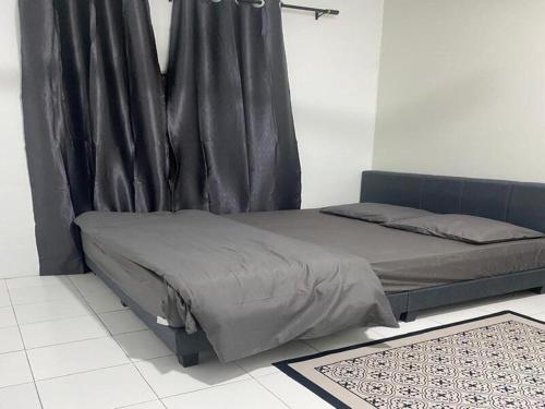 Ένα ή περισσότερα κρεβάτια σε δωμάτιο στο AISY Homestay MERAPOH