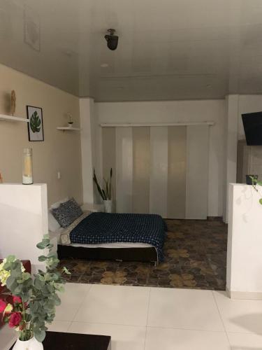 a bedroom with a bed in a room at casa hacienda tranquilidad in Estación El Salto
