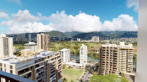 a view of a city with tall buildings at Spacious Waikiki Banyan Condo with Ample Sleeping, Walk to Beach, Great Views and Free Parking (22201) in Honolulu