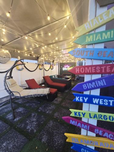 a room with chairs and signs on the ceiling at Gallego Deluxe Rental in Key Largo