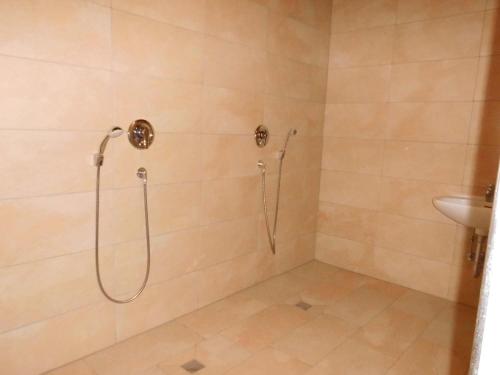 a bathroom with a shower and a sink at Germania-46 in Böhl