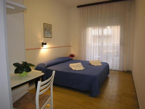 Postel nebo postele na pokoji v ubytování Hotel Garni Tahiti