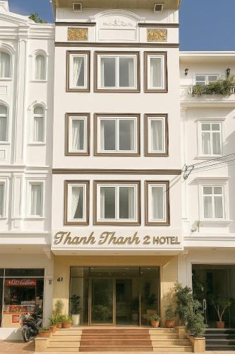 a large white building with a sign on it at THANH 2 Dalat in Da Lat