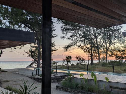 a view of the ocean from a house at The Beach House in Gili Meno