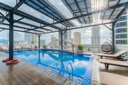 a large swimming pool on top of a building at Nha Trang Prince Hotel in Nha Trang