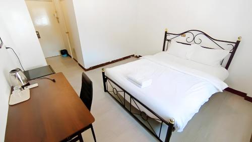 Postel nebo postele na pokoji v ubytování X GO INN Maya - Nimman Chiang Mai เมญ่า