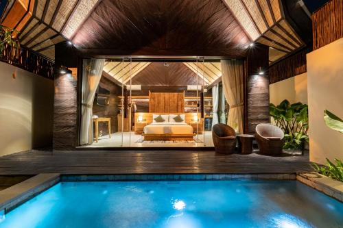 a pool in a villa with a bedroom at Villa Bolon in Kuta