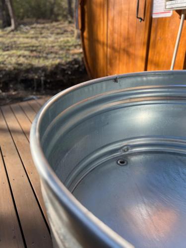 a large metal tub sitting on top of a wooden deck at Nasu Sauna Stay in Nasu